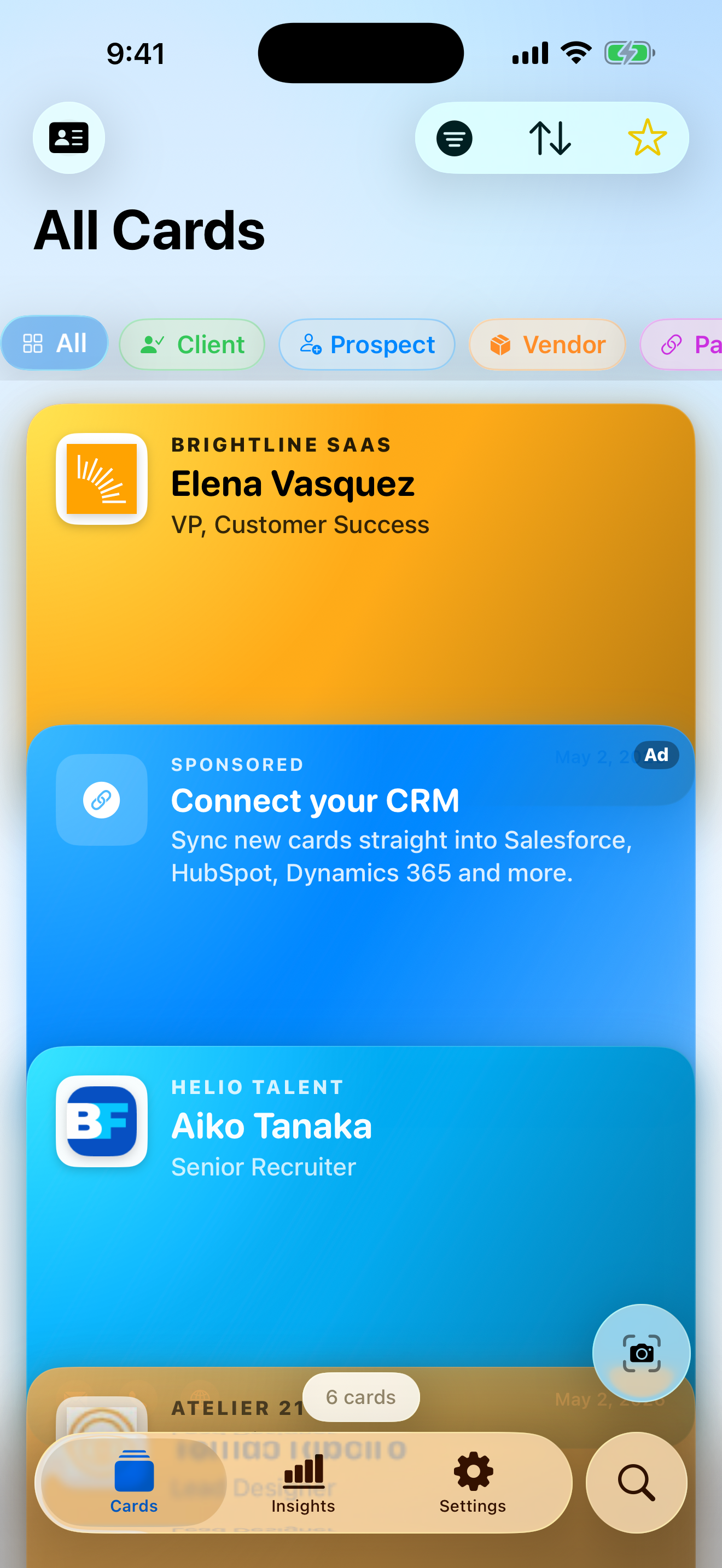 The CardHaus cards screen on iPhone, showing a wallet-style stack of recently scanned business cards.